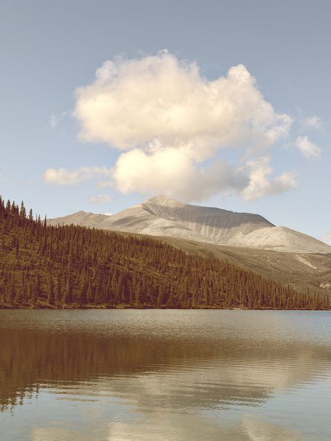 Cloud-Capped Mountain over Northern Rockies Lake