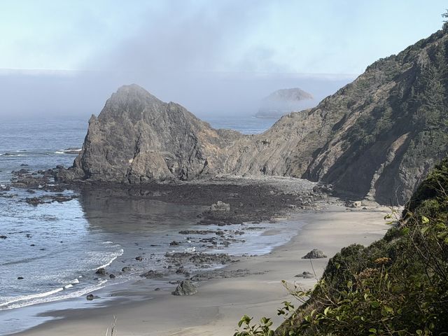 Foggy sea stacks at Curry County cove