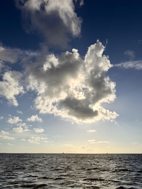 Sunlit Cloud Over Stock Island Horizon