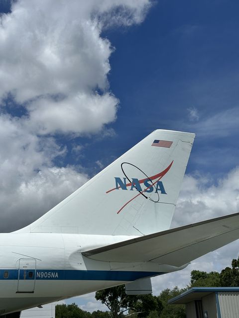 NASA jet tail under Houston clouds