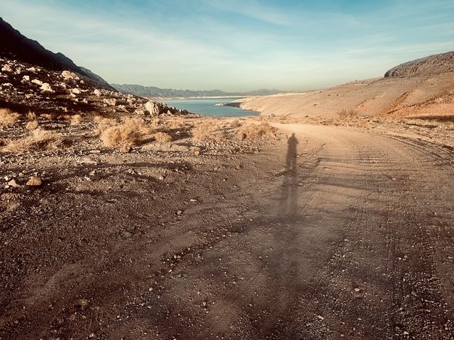 Long shadow on Arizona lakeshore road